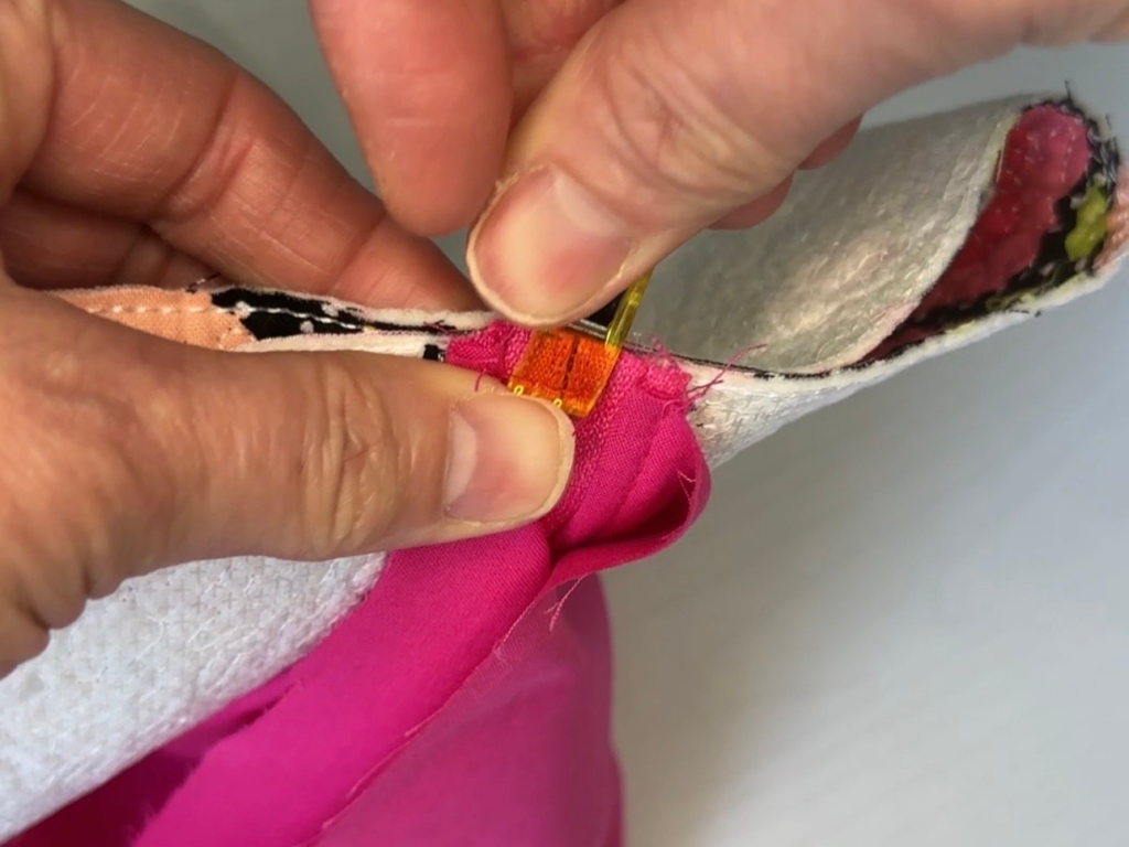 clipping the short sides together on a boxy bag